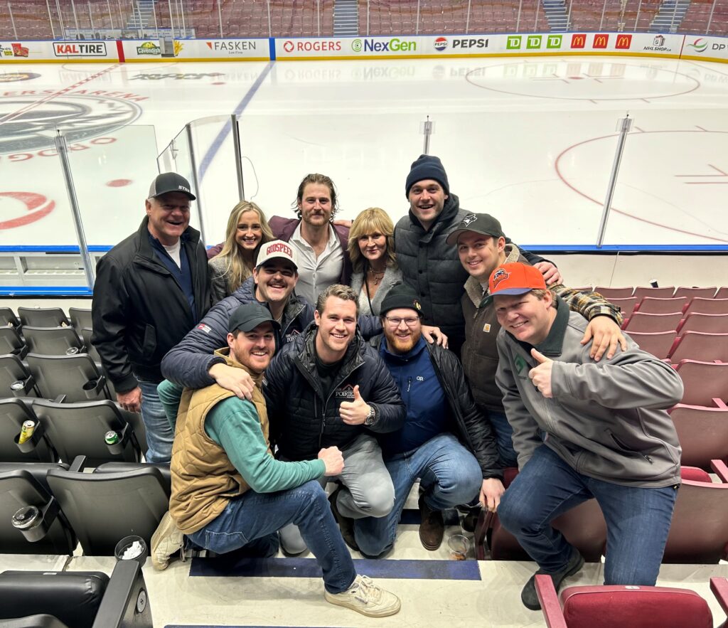 Family and friends pose for a picture with Tye Felhaber after his first game in the National Hockey League.